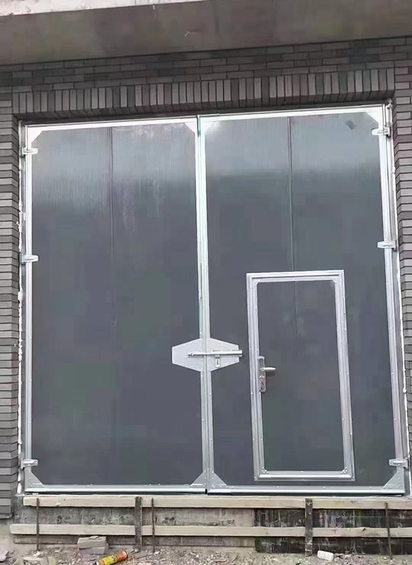 沙湾工业平开门在大型设备制造车间的应用实例